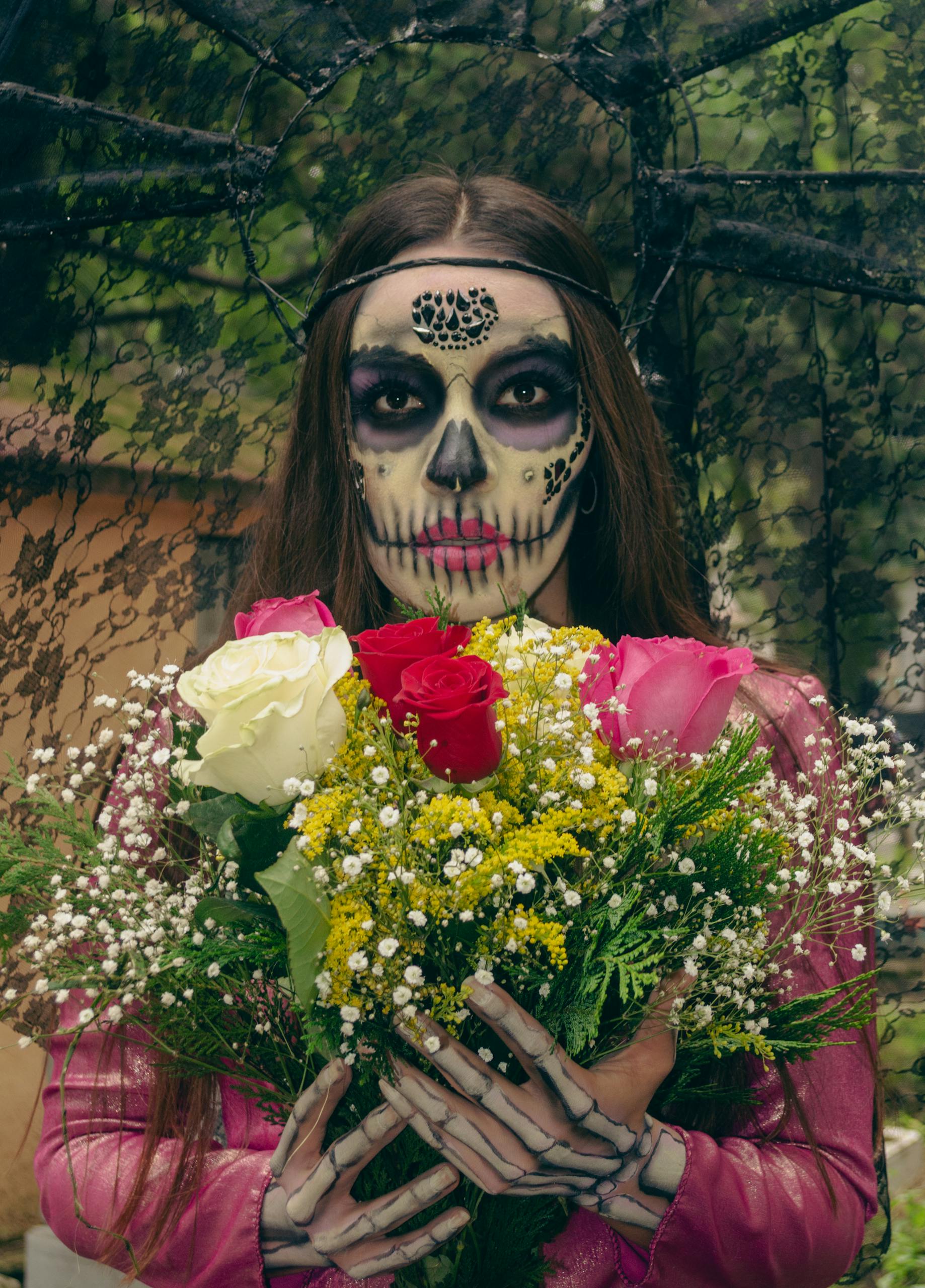 A vivid portrait of a Catrina with intricate makeup, holding a colorful bouquet for Día de Muertos.